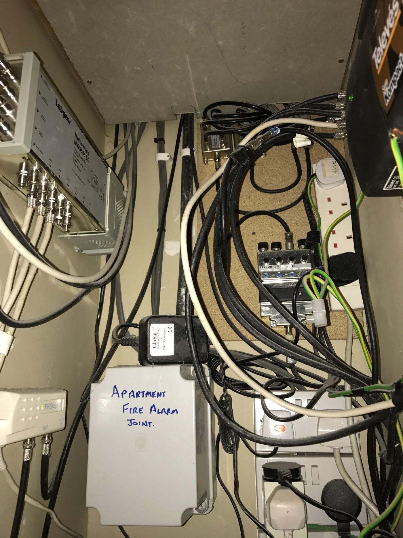 Communal TV head-end cupboard with multiswitch and amplifiers in a block of flats